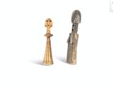 pair of wooden figurines of a man and a woman