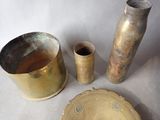 three different types of vases and a plate on the table