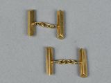pair of gold tone cufflinks with chain links