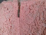 pink lace dress on mannequin neckline with zipper