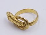 an image of a gold ring with a snake on it