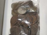 a bag full of coins sitting on a table