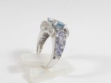 an image of a ring with blue and white diamonds on a white background