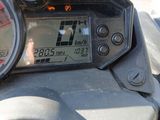 a close up of a motorcycle ' s dashboard with a clock on it