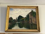 un tableau accroché au mur au-dessus d'un autre tableau