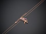 a gold bracelet with an elephant and a heart charm on it