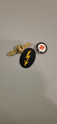 two badges that are on the table together