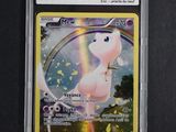 a close up of a pokemon card with a rainbow in the background