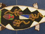an image of a decorative fish on a tile floor