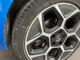 a close up of a tire on a blue car