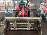 a tractor that is parked in a garage