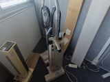 an image of a room with a vacuum cleaner and other items