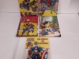 une pile de bandes dessinées posée sur une table blanche