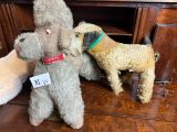 two stuffed animals that are sitting on a table