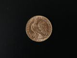 a close up of a coin on a black surface