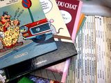a pile of children ' s books sitting on a table