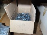 a box full of screws sitting on top of a table