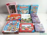 many children ' s books and games on the table