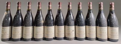 six bottles of wine are lined up in a row on a table