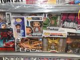 a display case filled with various toys and action figures
