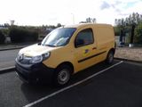 a yellow van that is parked in a parking lot