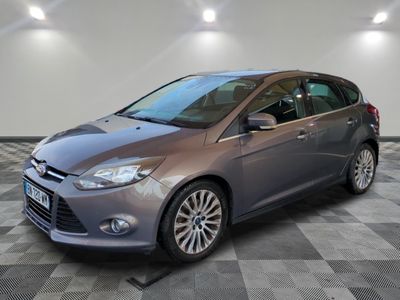 the ford focus is parked on a checkered floor in a garage