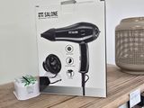 packaging of a hair dryer sitting on top of a wooden table