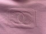 chanel logo on a pink sweater with a white background