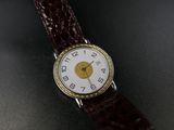 an image of a close up of a wrist watch on a table