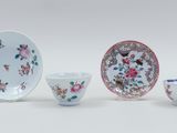 four pieces of chinese porcelain with flowers and birds on them