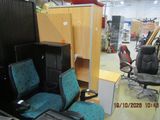 a photo of a room with a desk, chair, and cabinets