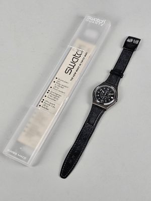 the watch is black and has a black leather strap