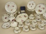 many different types of china plates and bowls on the table
