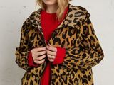 an image of a woman wearing a leopard print jacket