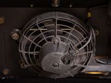 a fan that is attached to the side of a vehicle
