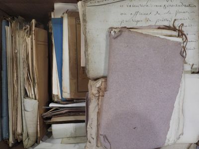 books are stacked on top of each other on a shelf