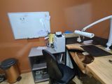 a desk with a computer and a monitor on it