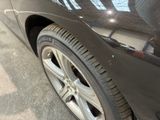 a close up of a car ' s tire on the street