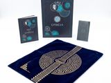 an image of a set of three playing cards with a blue velvet bag
