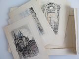 four cards in a white box with drawings on them