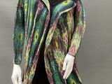 an image of a mannequin wearing a multicolored jacket and black pants