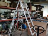 a ladder that is sitting in the middle of a room