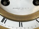 a clock with roman numerals on the face of it