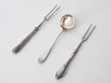 three spoons and two forks sitting on a table