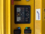 a close up of a yellow machine with buttons on it