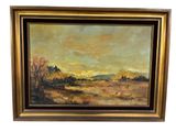 une peinture à l'huile représentant un paysage, dans un cadre doré, sur fond blanc