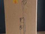 the box of a vacuum cleaner sitting on top of a wooden table