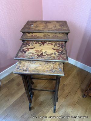 three nesting tables that are sitting on a hard wood floor