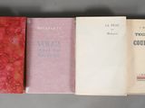 three books sitting on top of a table next to each other