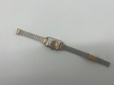 a close up of a wrist watch on a white surface